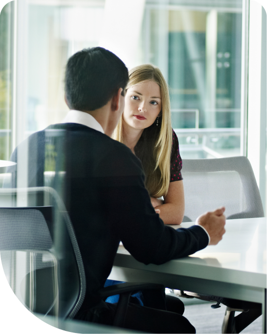 Man and woman talking in an office