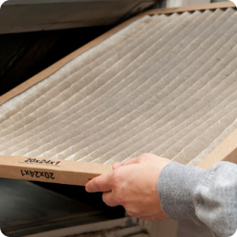 hands holding air filter
