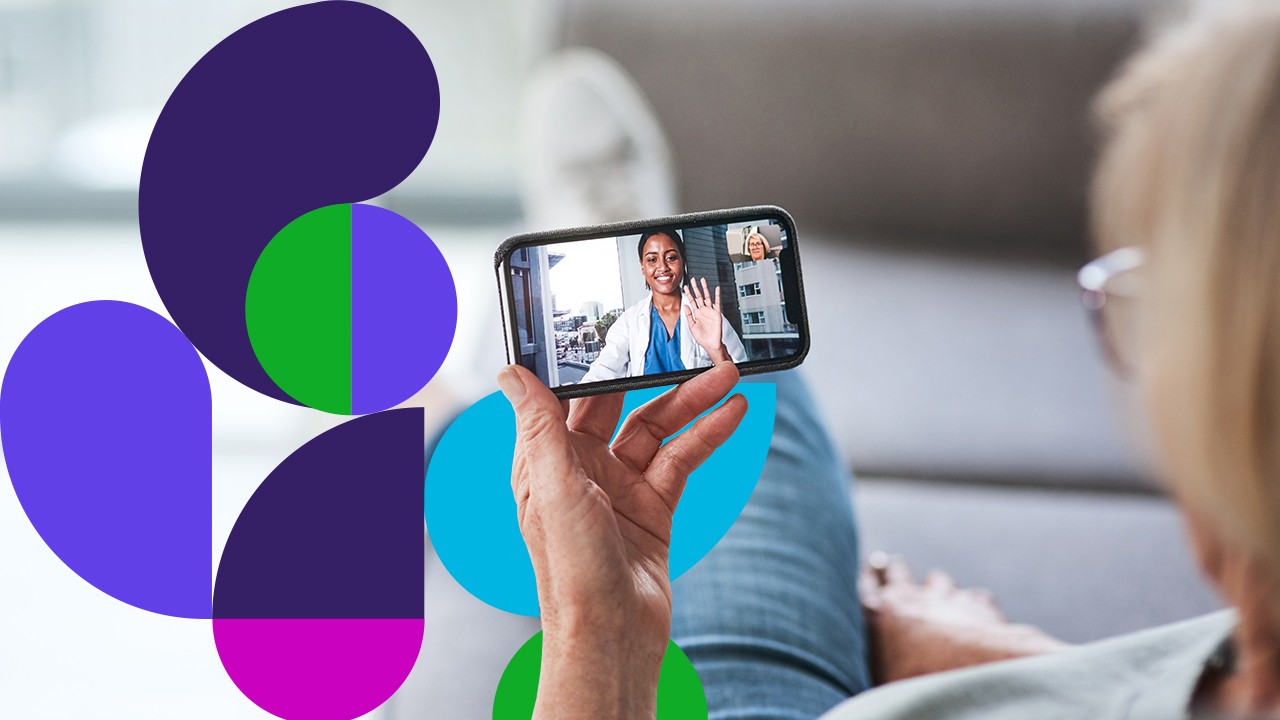 Person holding phone showing doctor on screen