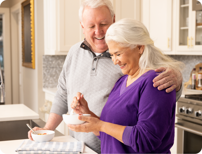 Couple standing in kitchen